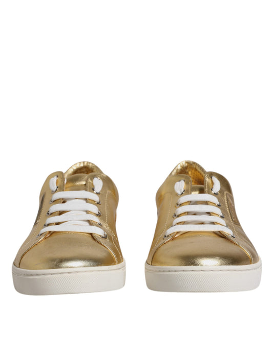 Gold glittery sneakers with white laces and soles