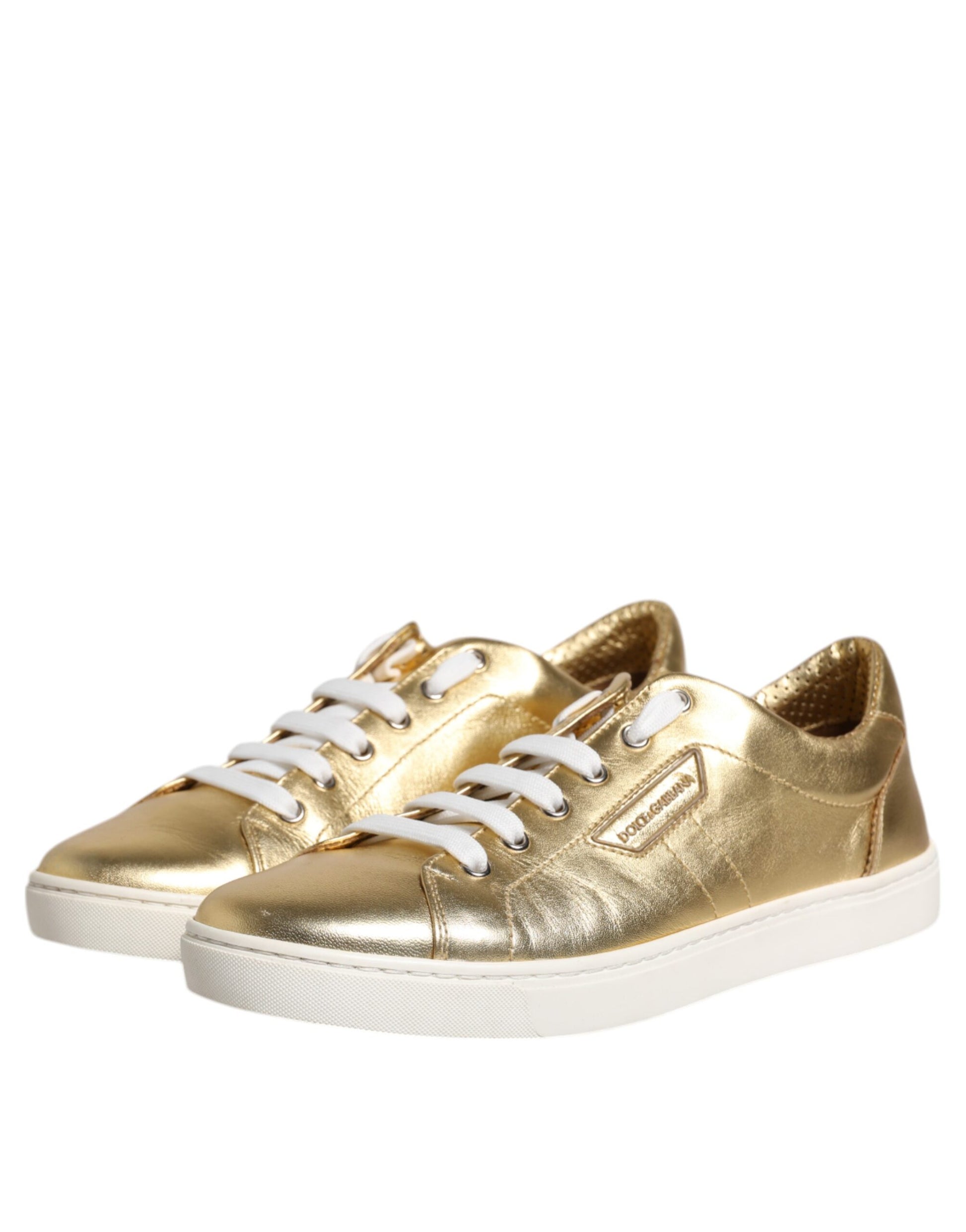 Gold glittery sneakers with white laces and soles