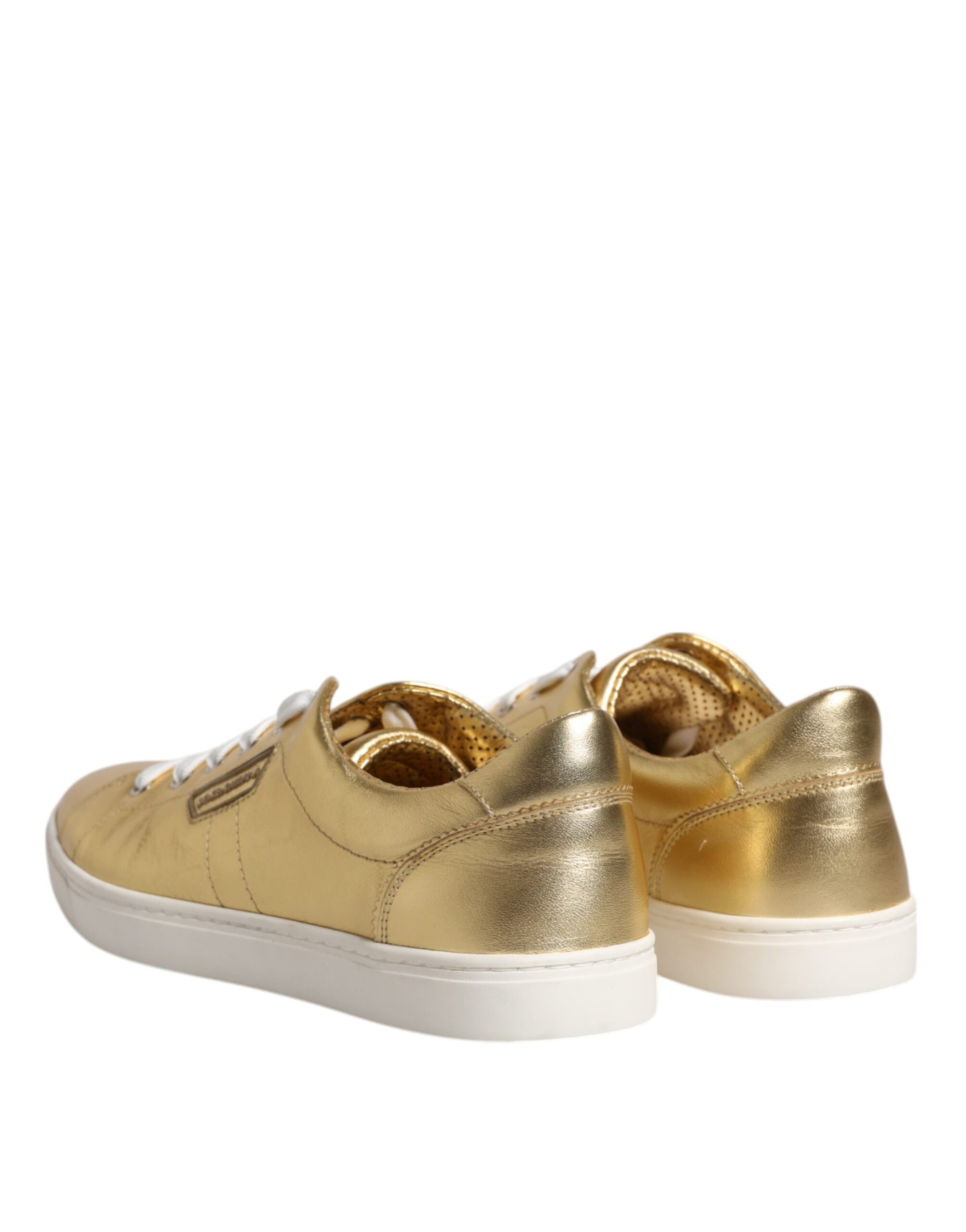 Gold sneakers with white soles and laces