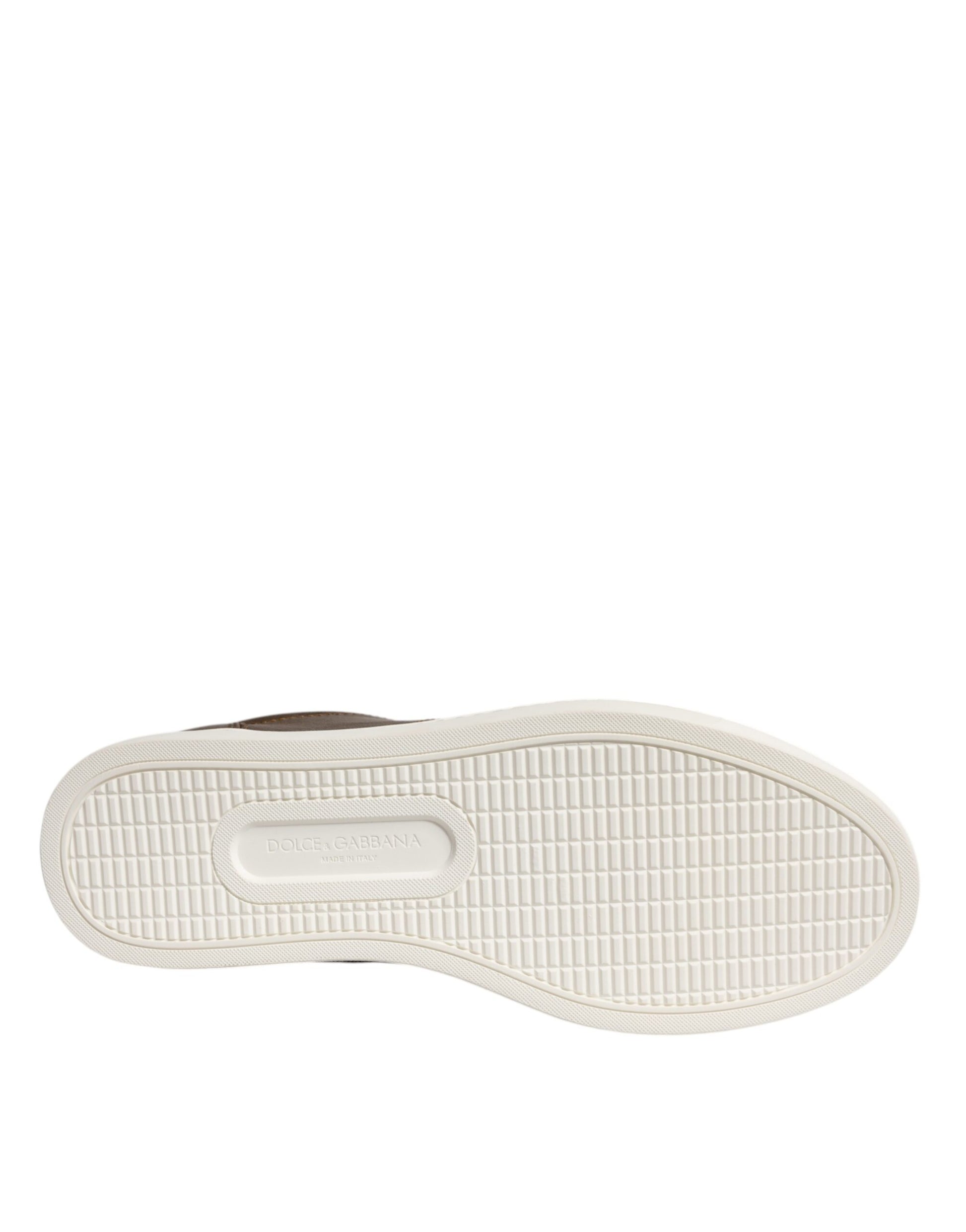 White sneaker with gold logo on side, featuring a rubber sole and laces