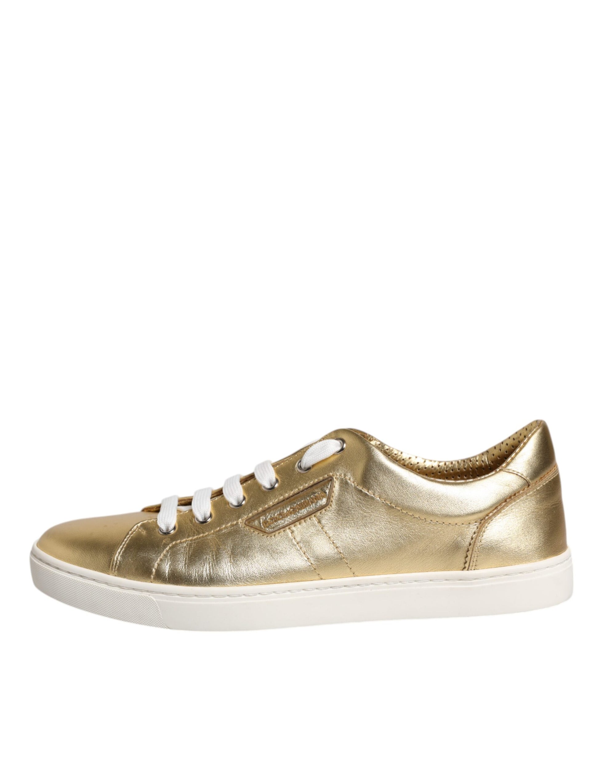 Gold glittery sneakers with white laces and soles