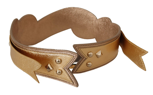 Bracelet with gold stars and spikes on a brown background