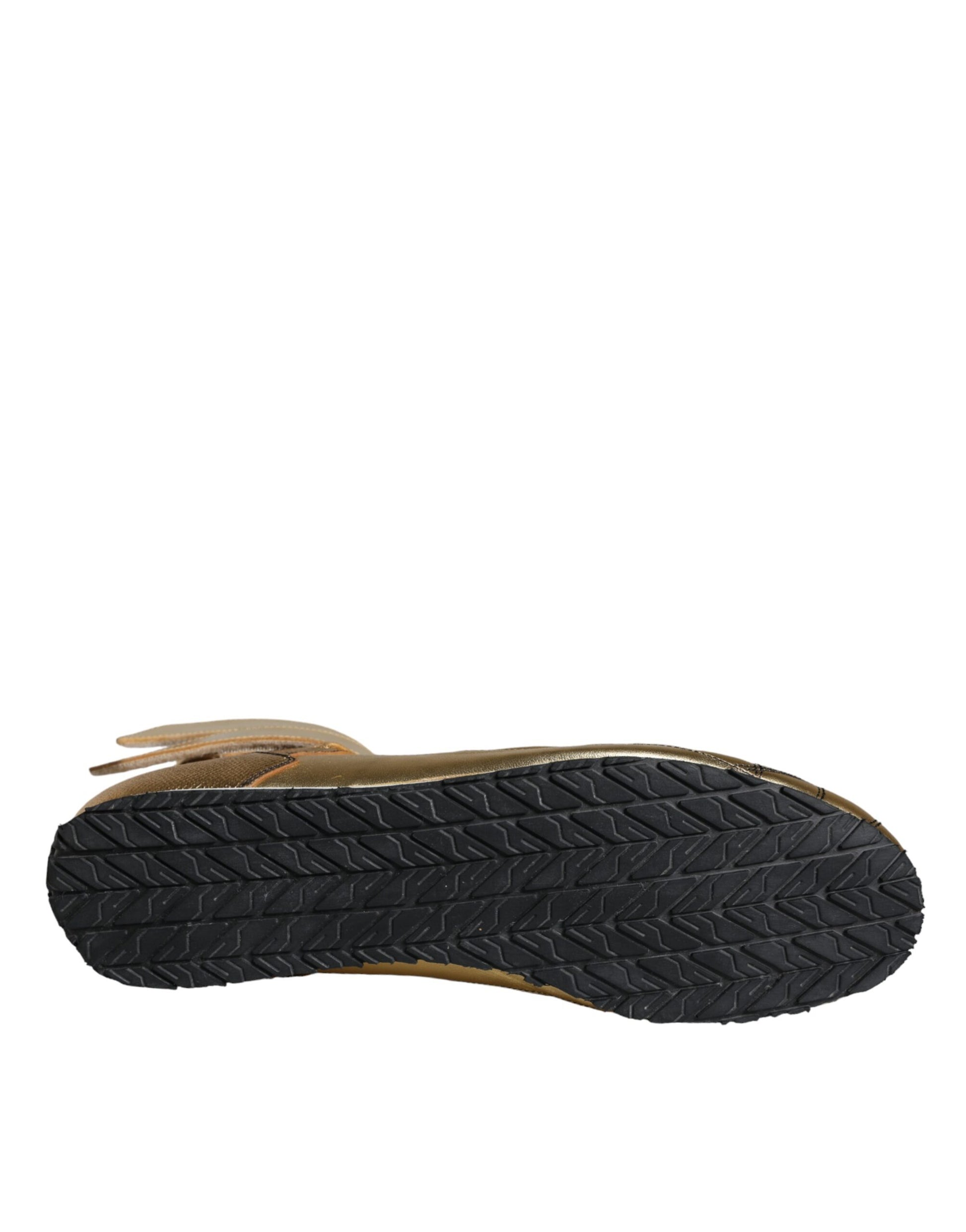 A single high top sneaker with a gold leather upper and black sole