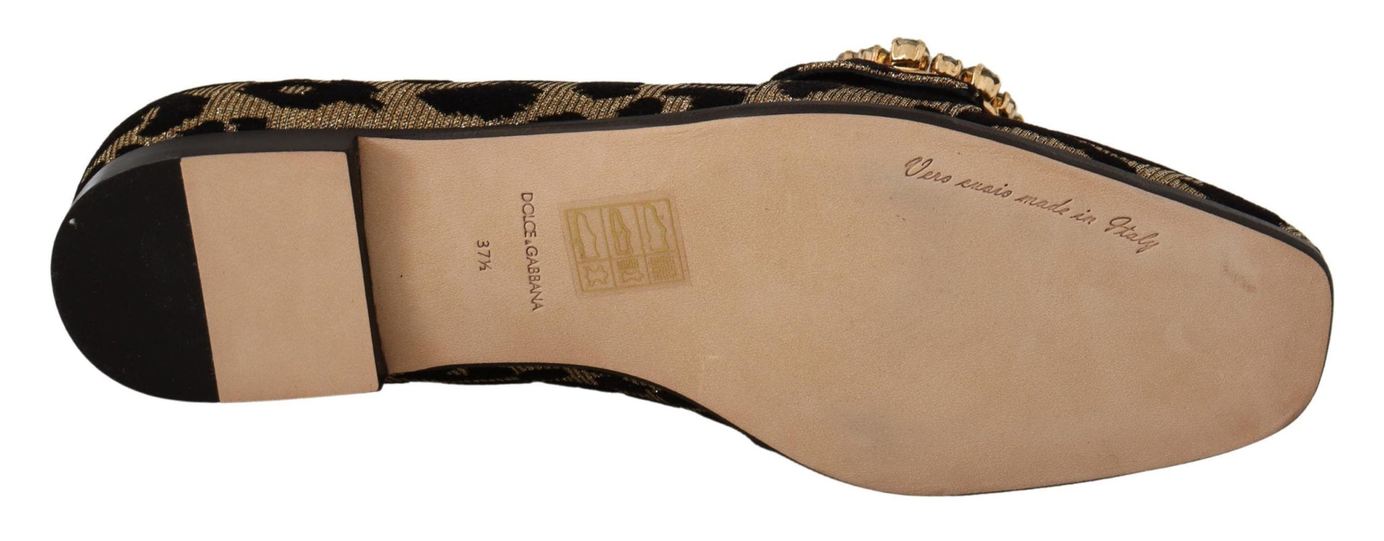 Pair of brown shoes with gold accents and black soles