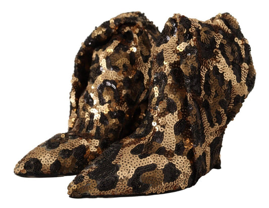 Pair of glittery gold and black leopard print boots with fur trim