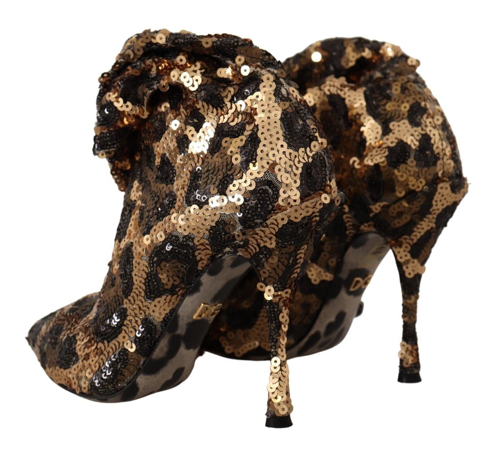Pair of glittery gold and black high heel shoes with animal print design