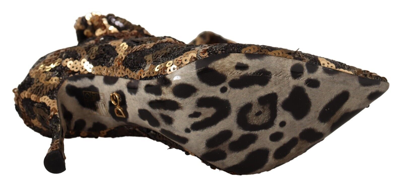 Leopard print fabric with gold sequins on a mannequin torso