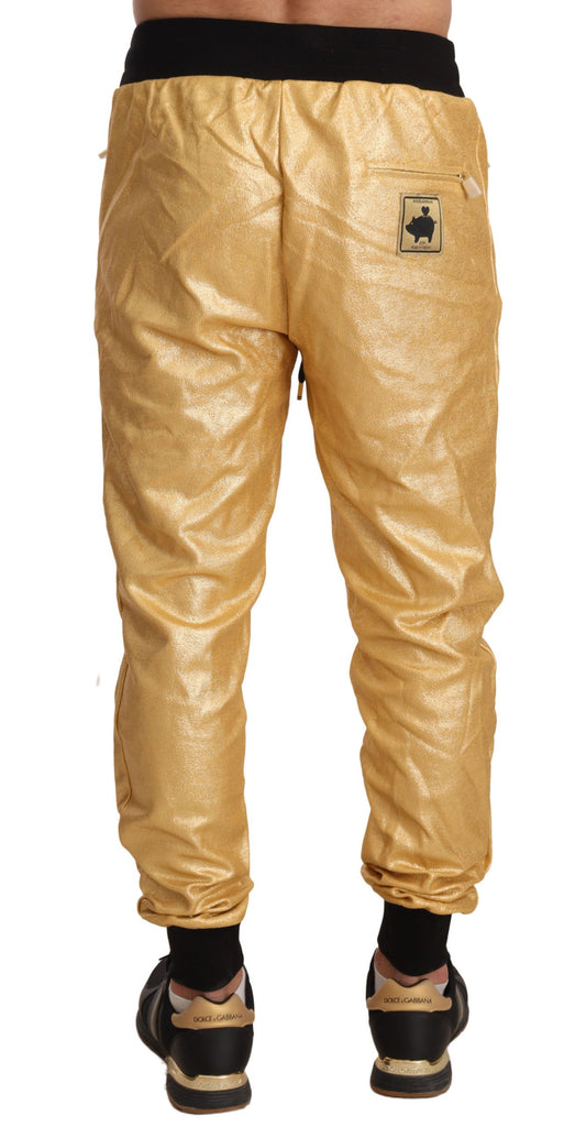 Yellow track pants with black logo on left leg