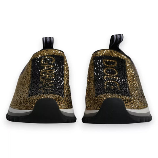 Pair of glittery dog-themed sneakers with gold lettering and a black sole