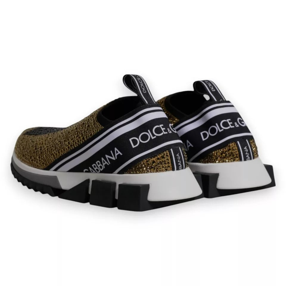 Pair of sneakers with glittery gold and black design featuring brand logos