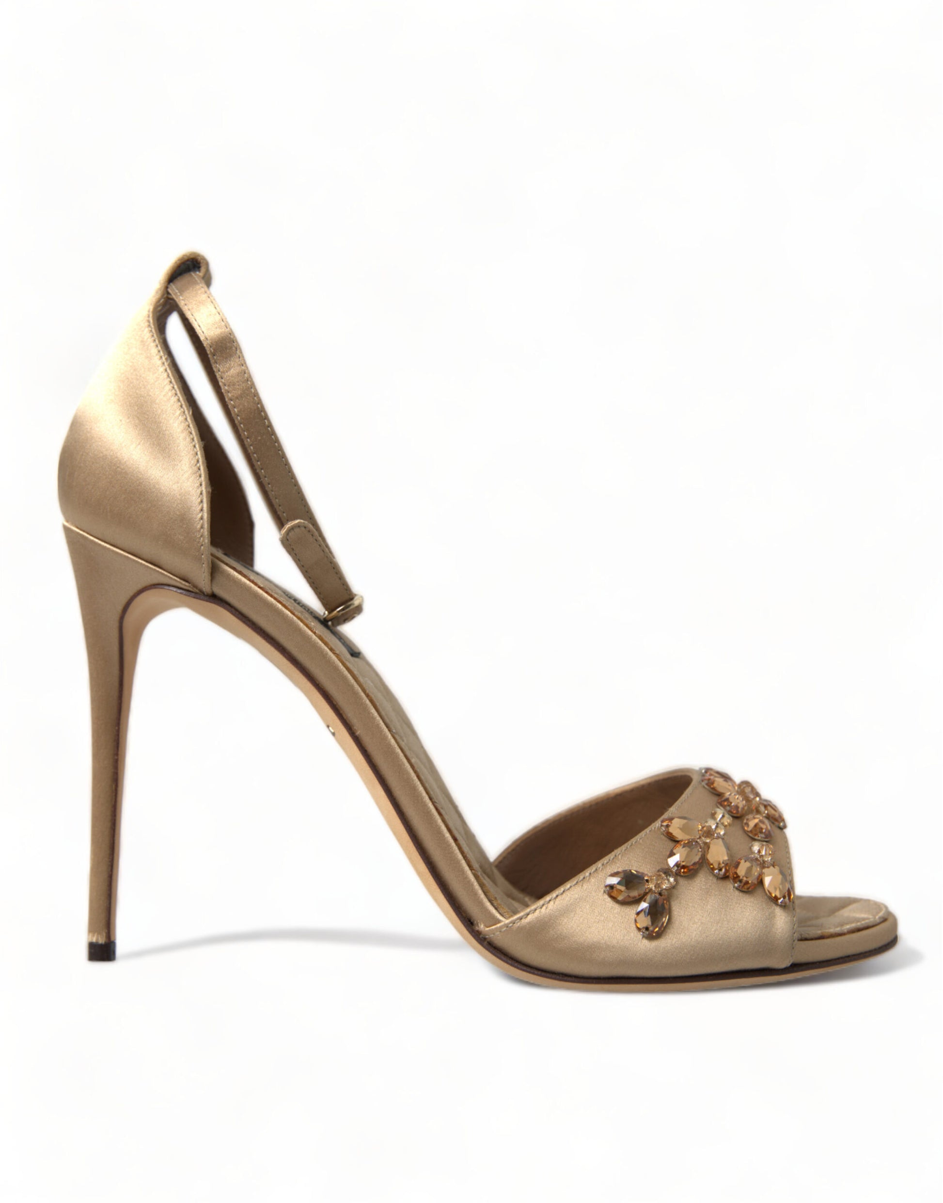 Gold high heel shoe with embellishments on toe and ankle strap