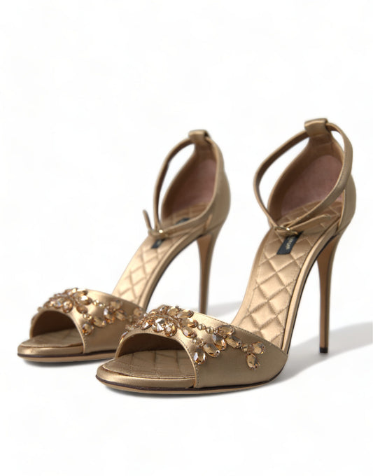 Gold high heel shoes with embellishments and ankle straps