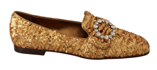 Gold glittery women's shoe with bow and rhinestones