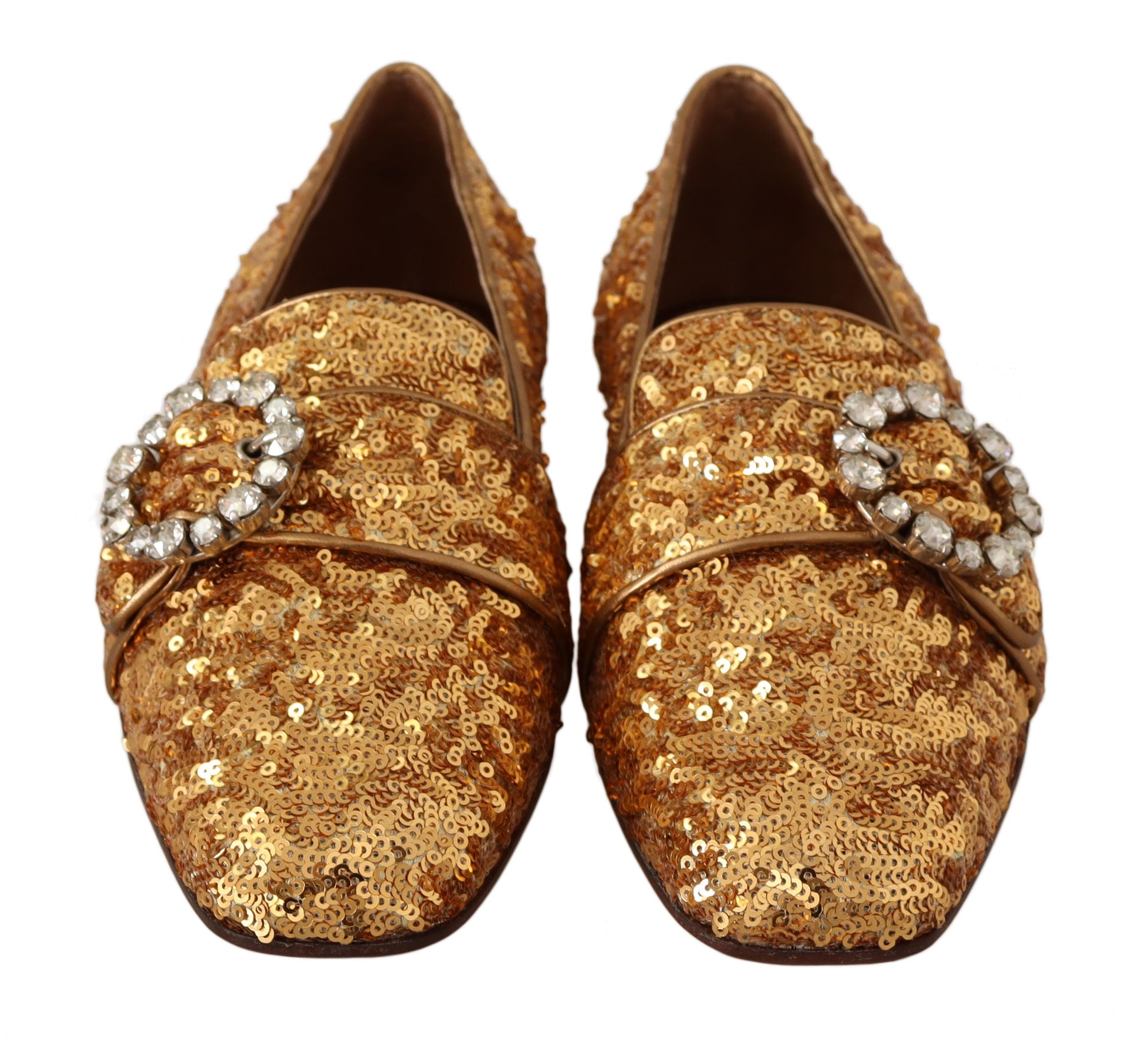 Pair of gold glittery women's shoes with a bow and rhinestones on top
