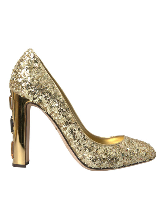 Gold glittery high heel shoe with a pointed toe and gold heel