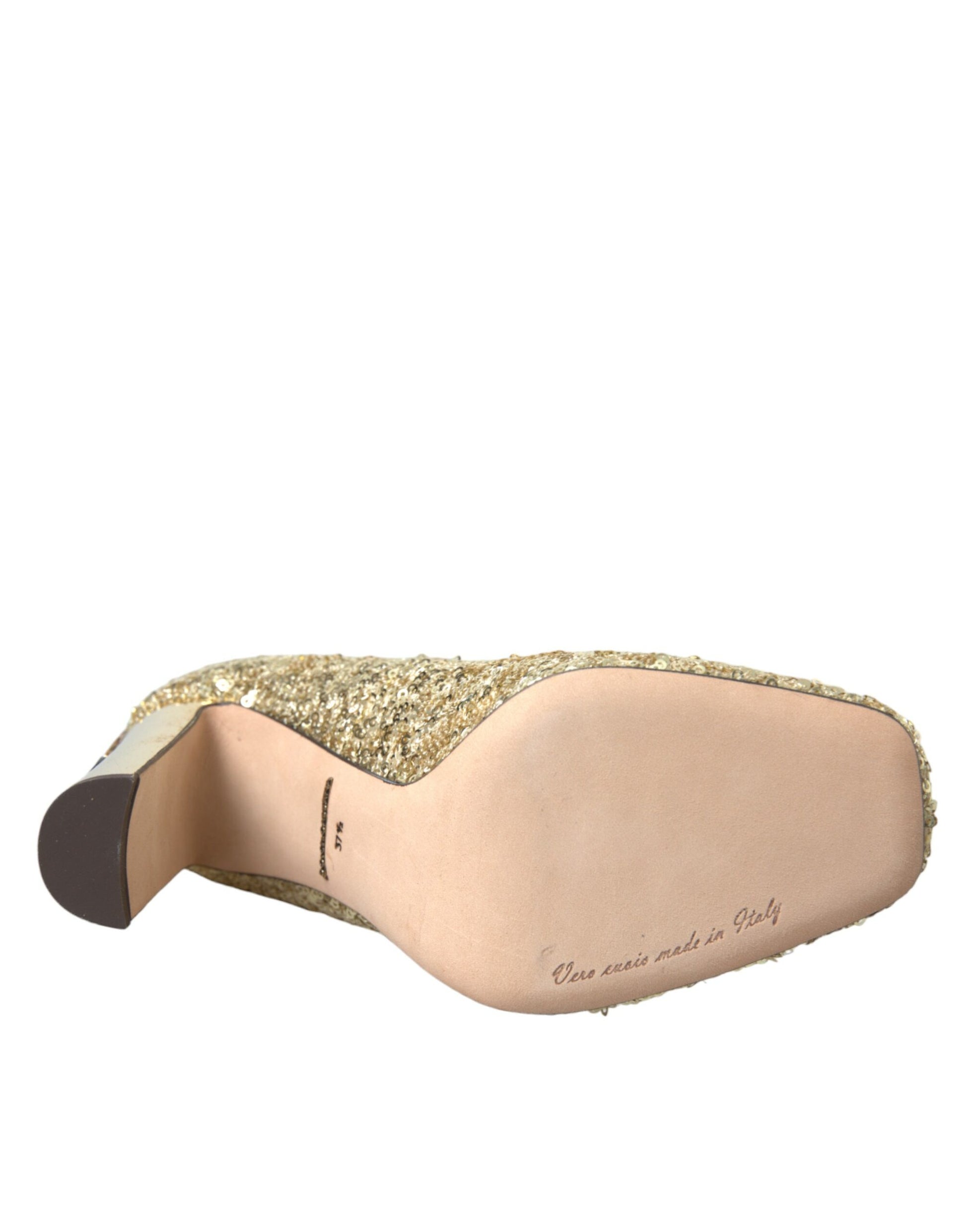 Brown leather shoe with gold glittery material on top and a black sole