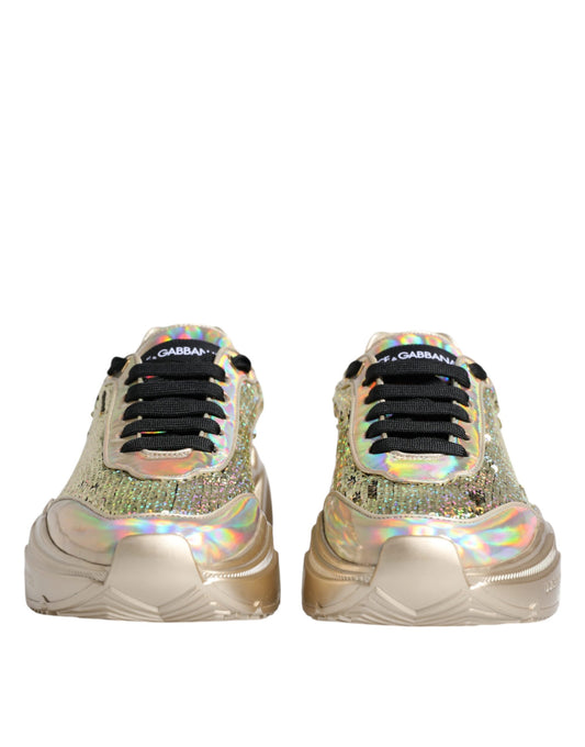 Pair of gold sneakers with glittery design on soles and laces