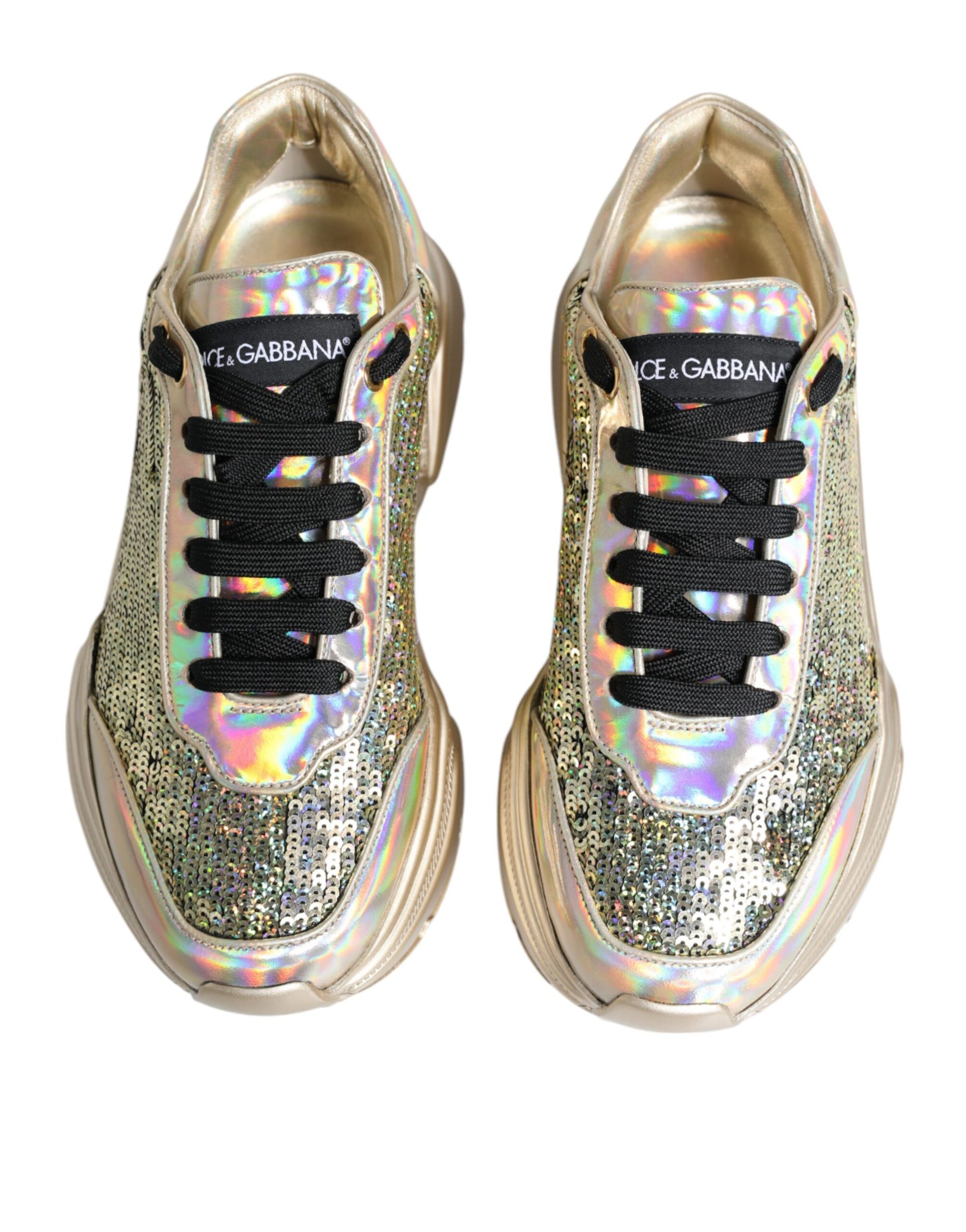 Pair of gold and silver sneakers with a glittery texture