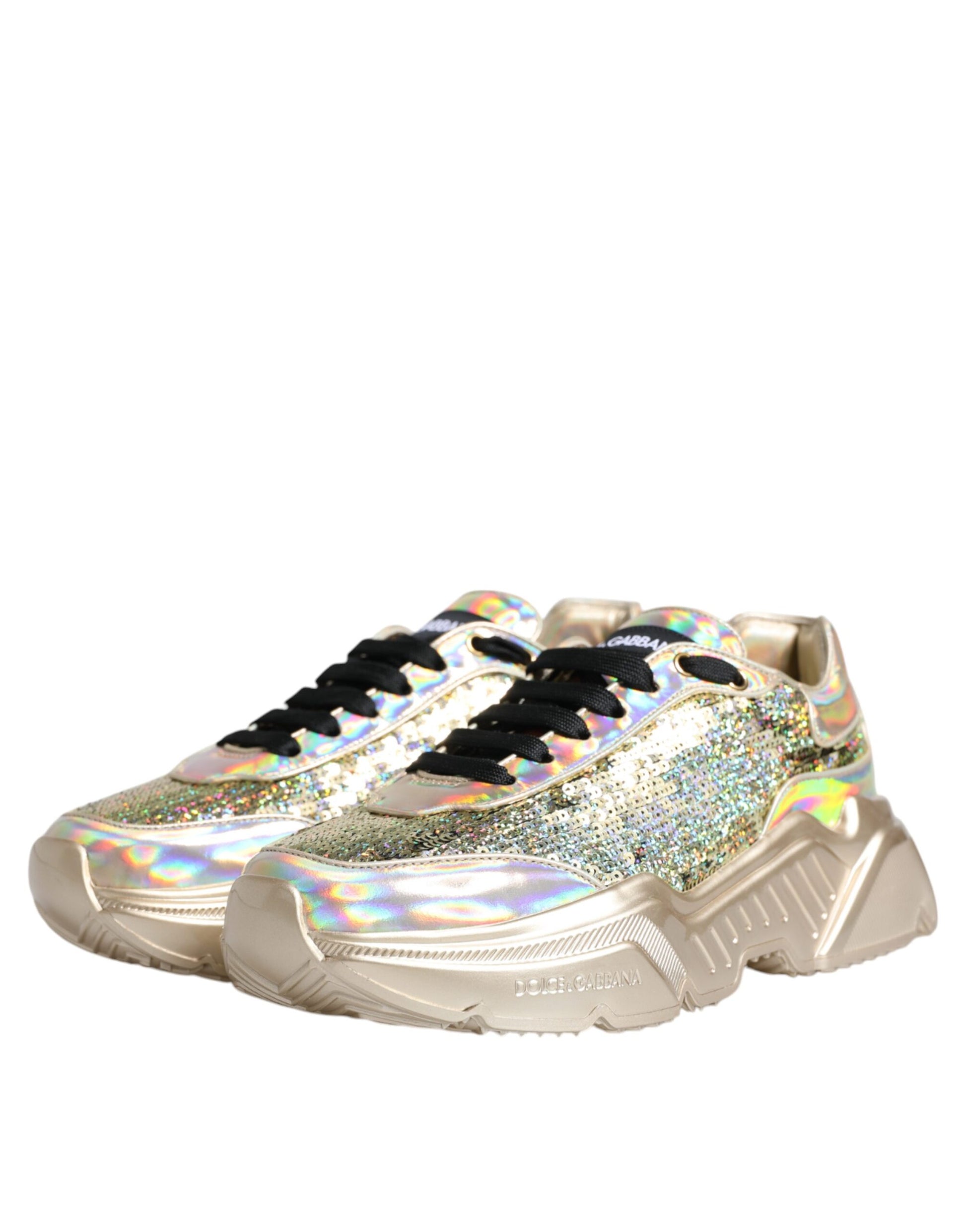 Gold glittery sneakers with black laces and a white sole