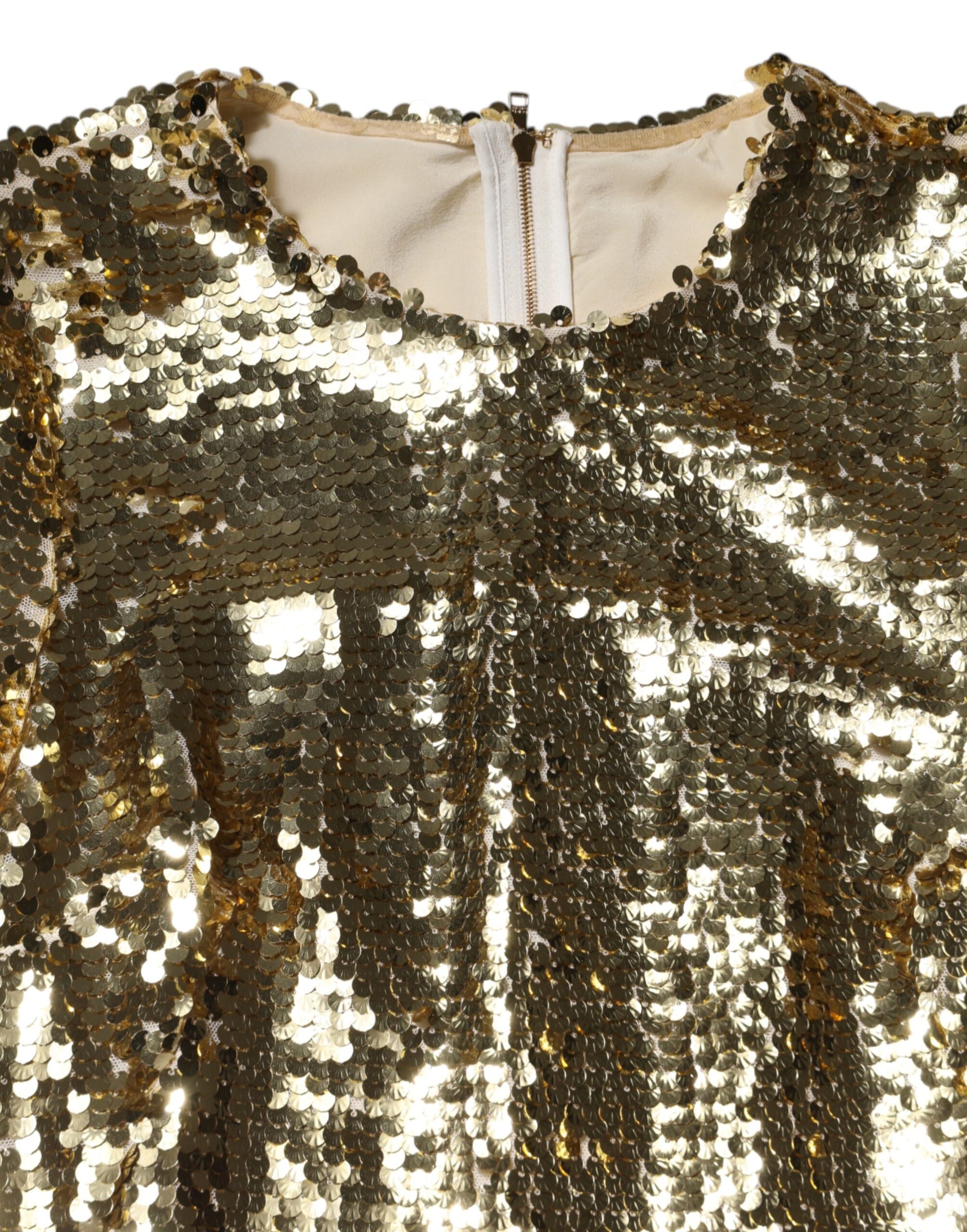 A long sleeved gold sequin mini dress