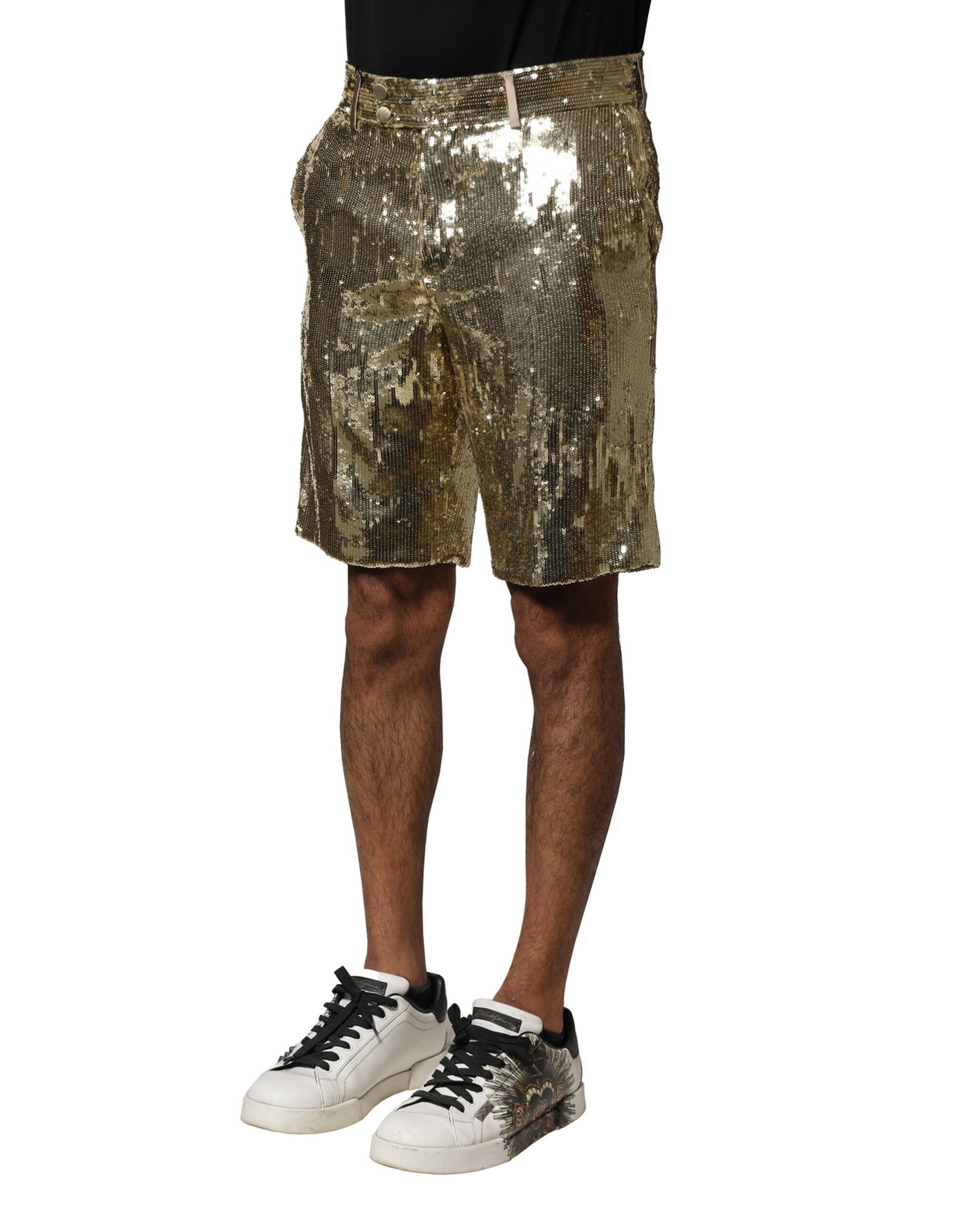 Man wearing gold glitter shorts and black sneakers