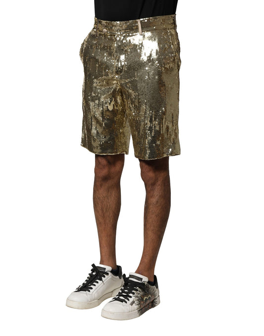 Man wearing gold glitter shorts and black sneakers