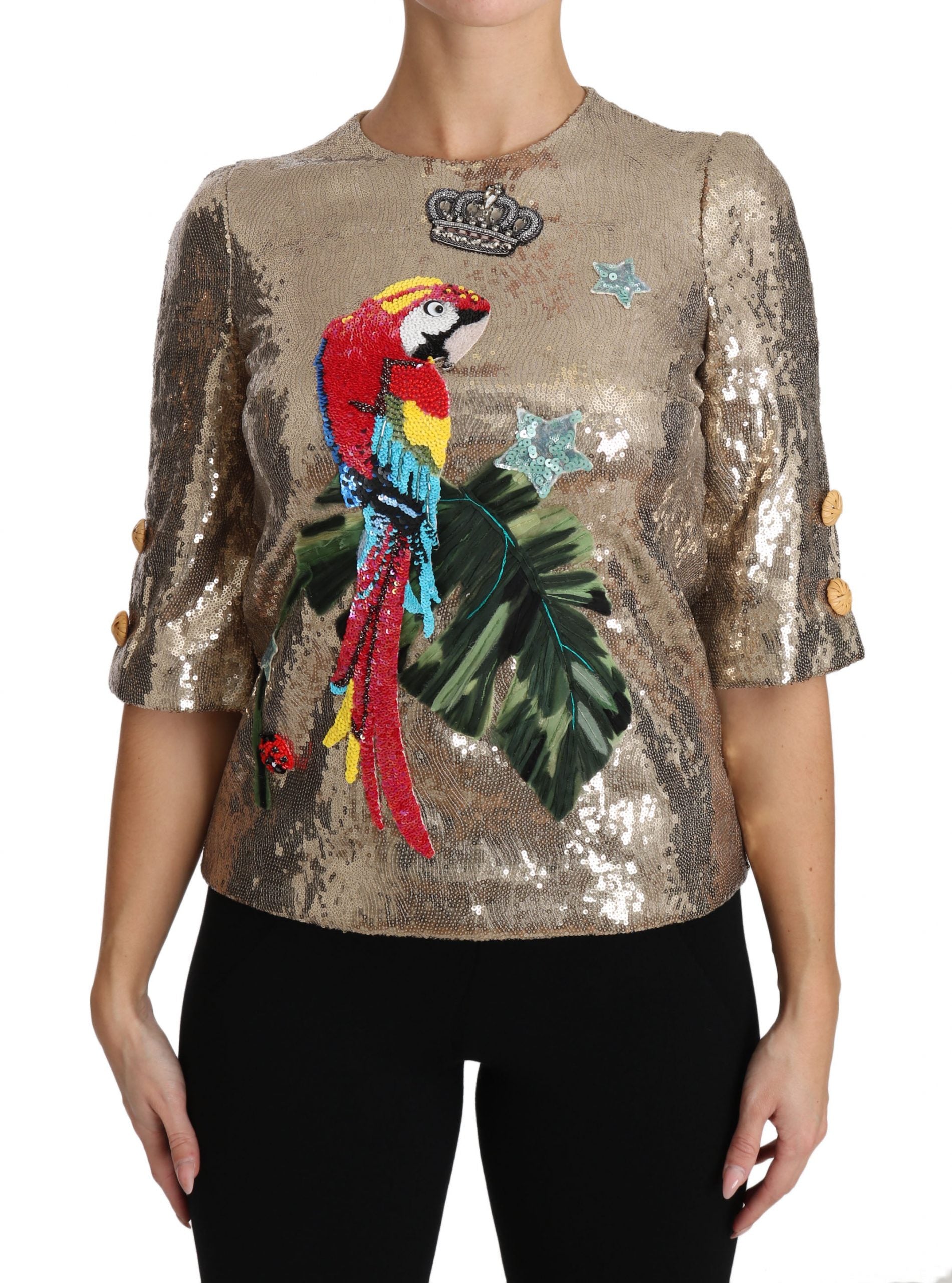 Woman wearing a sequined top with a parrot design
