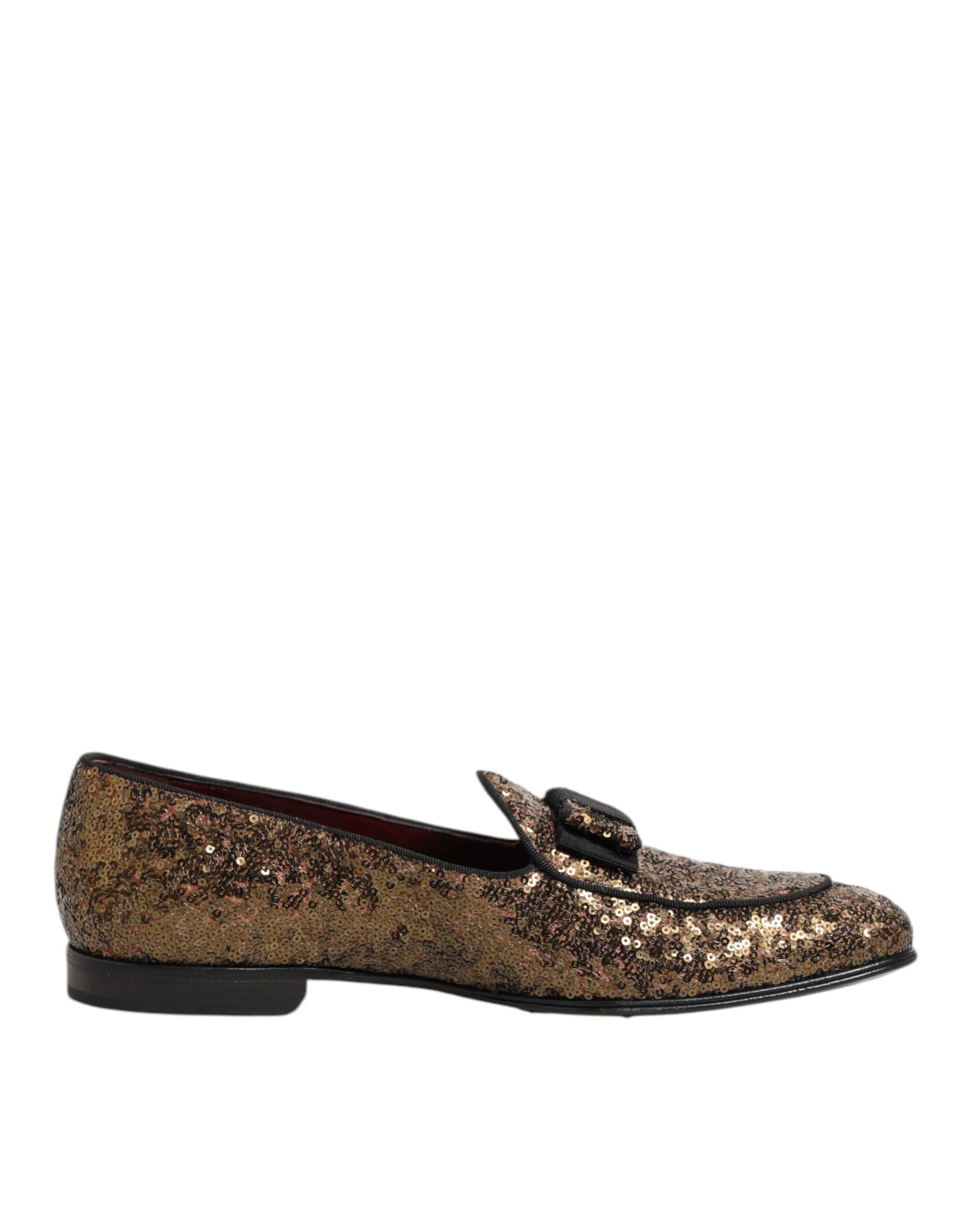 A pair of gold sequined loafers with a slip-on design