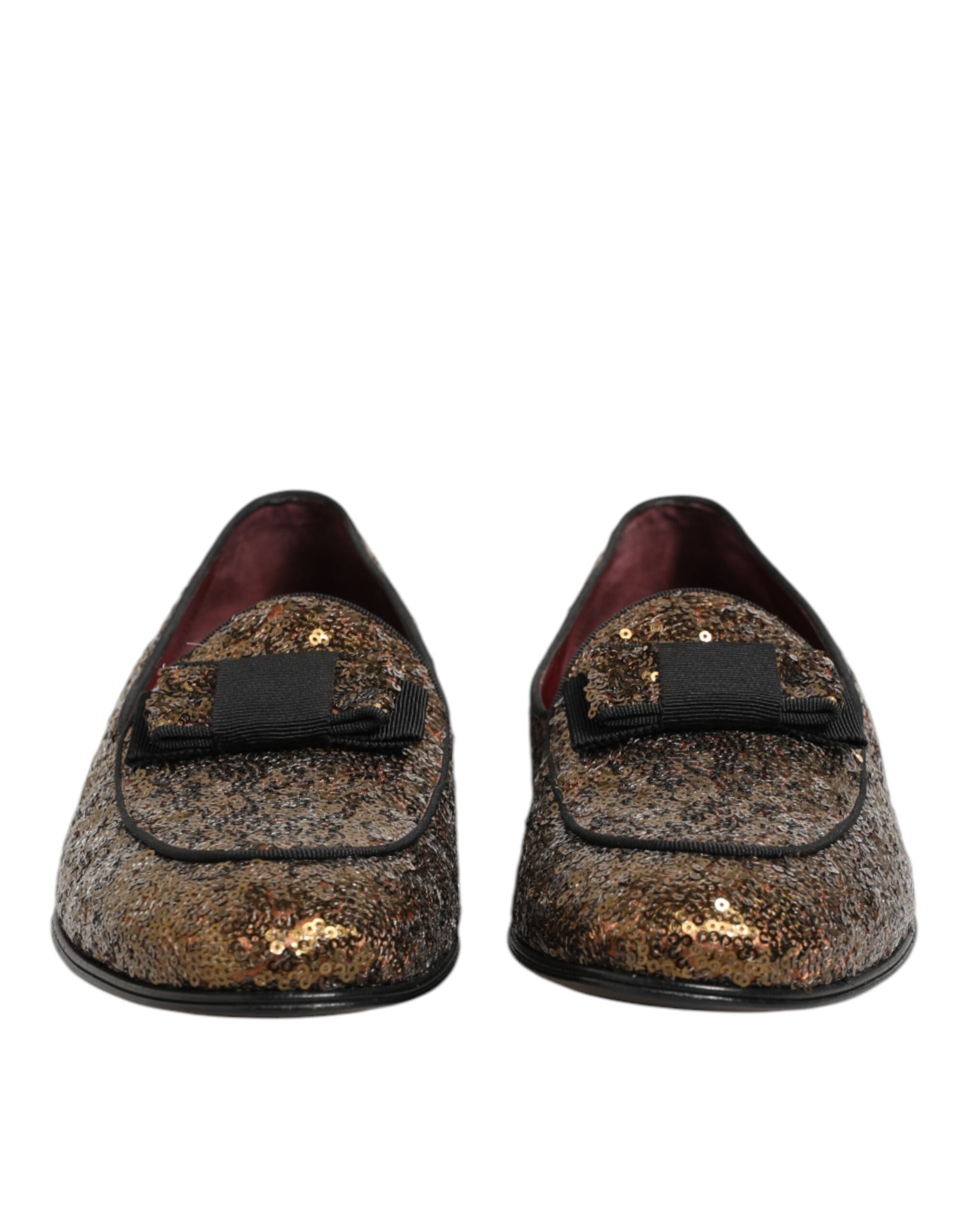 Pair of gold sequin loafers with black trim and elastic closure
