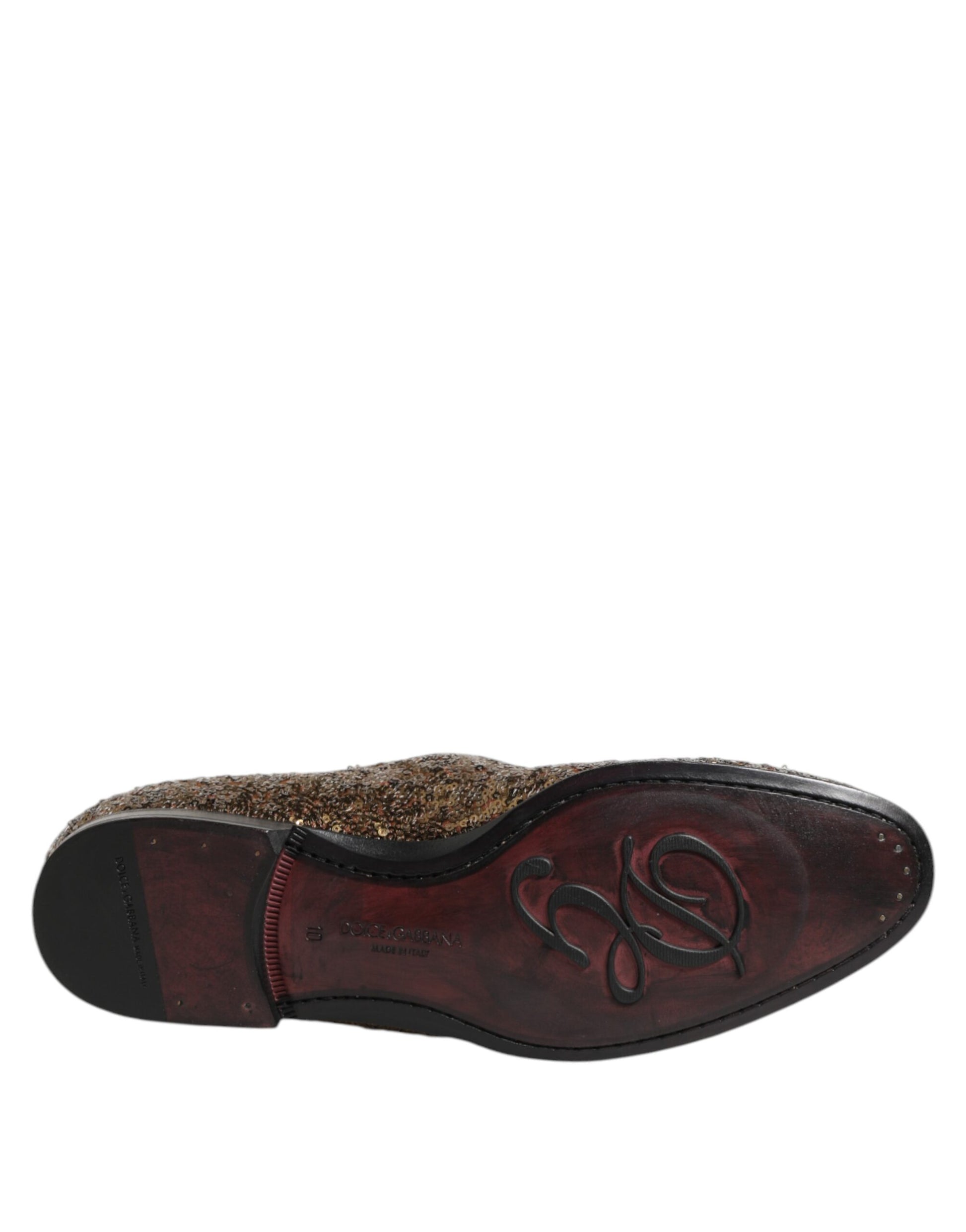 A pair of men's dress shoes with gold sequins and a logo on the side