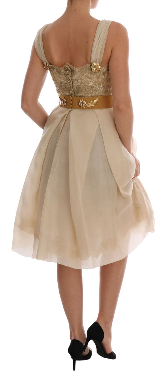 A woman wearing a gold silk dress with crystal embellishments
