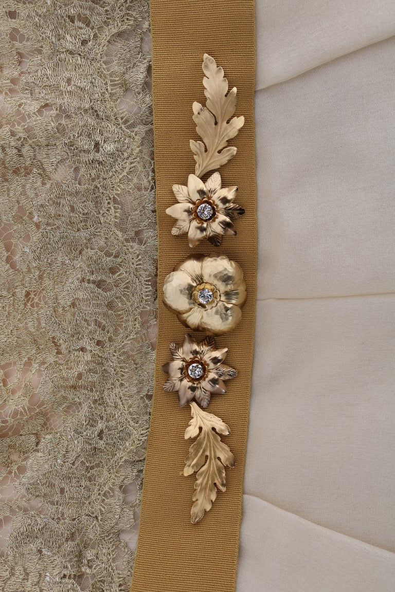 A gold silk dress with crystal embellishments and a matching belt