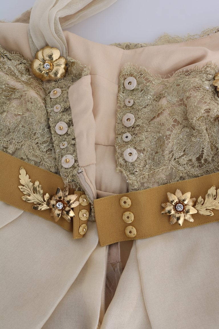 A gold silk dress with crystal embellishments and a beige satin bodice