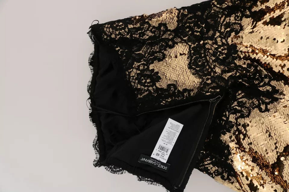 Black lace dress with gold sequin embellishments and sheer black fabric