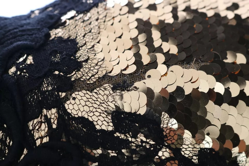 A black lace dress with gold sequin embellishments