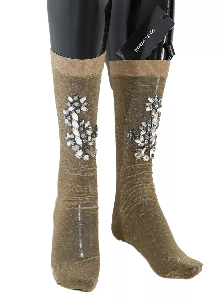 Pair of knee high boots with glittery embellishments on sides