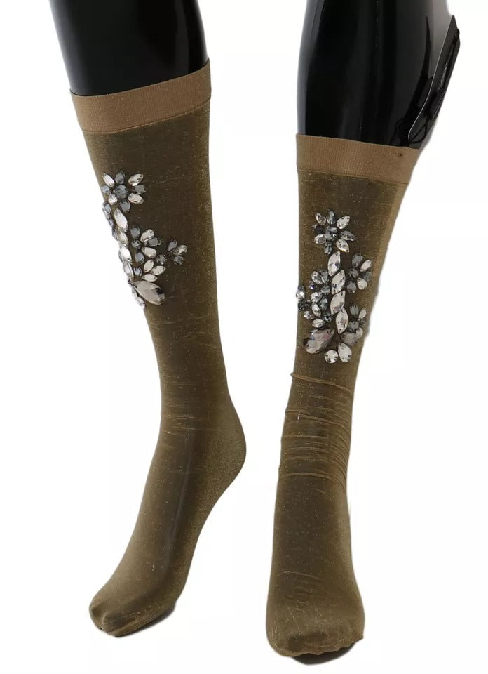 Pair of knee high boots with embroidered floral designs on sides