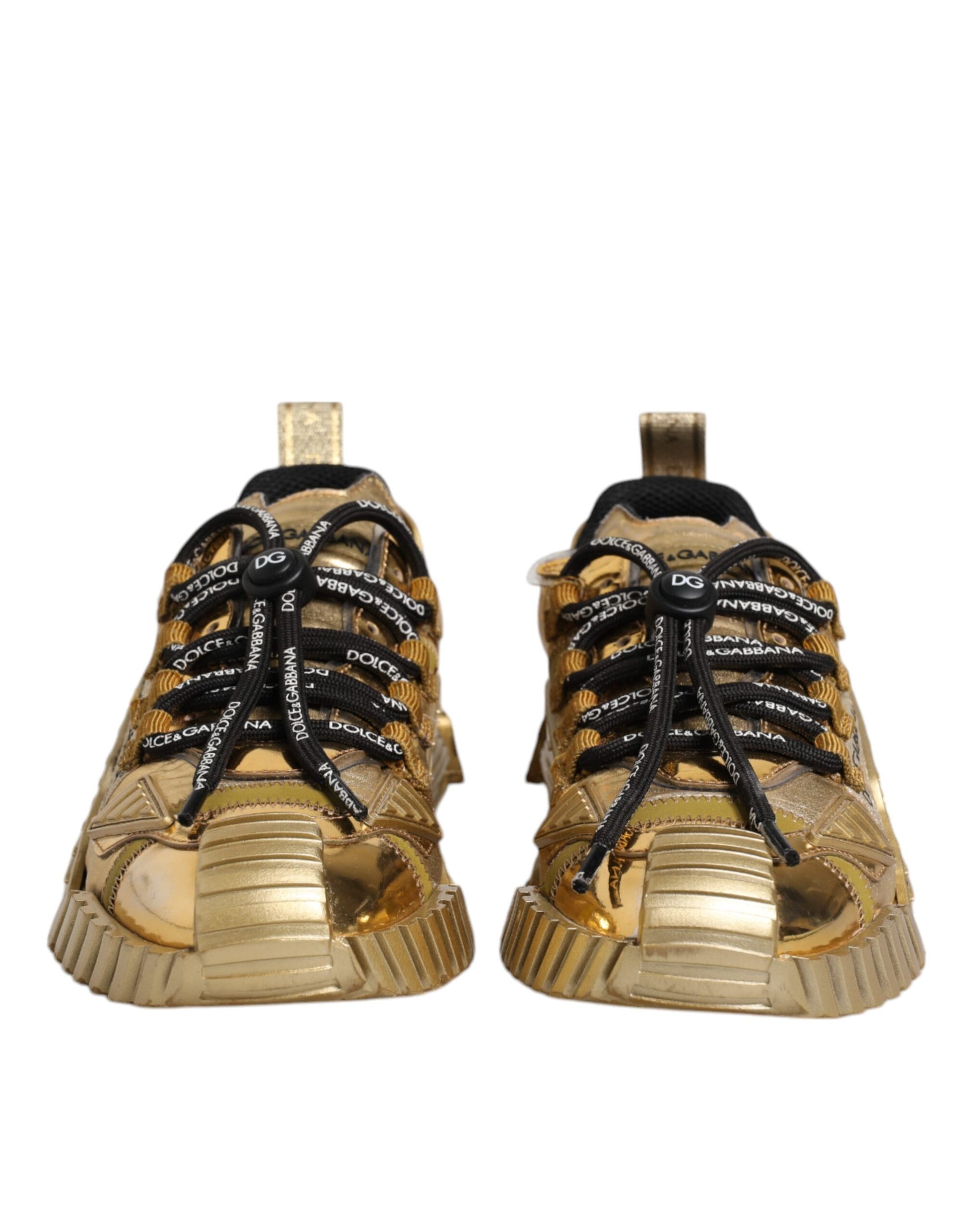 Pair of gold sneakers with black laces