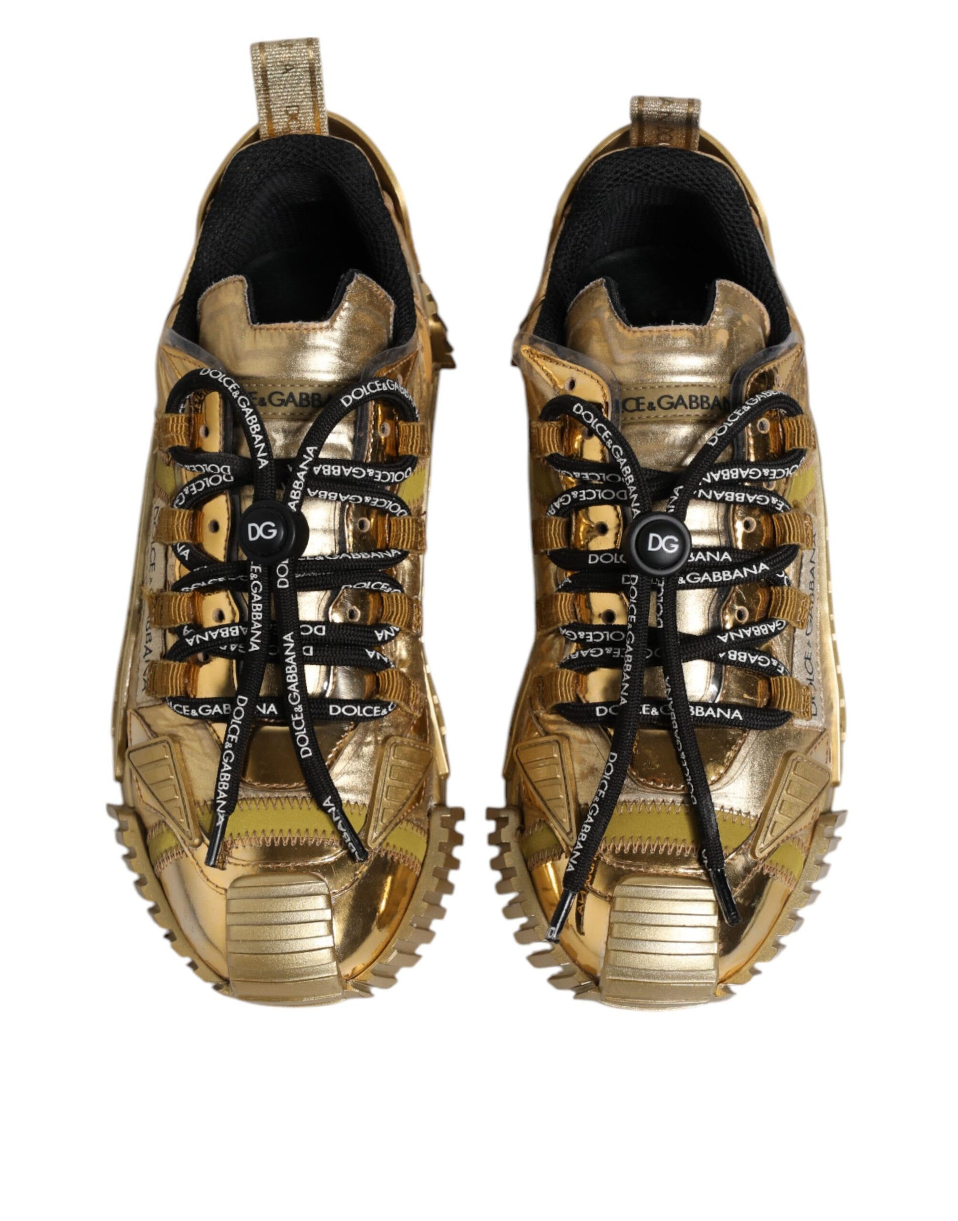 Pair of gold sneakers with black laces