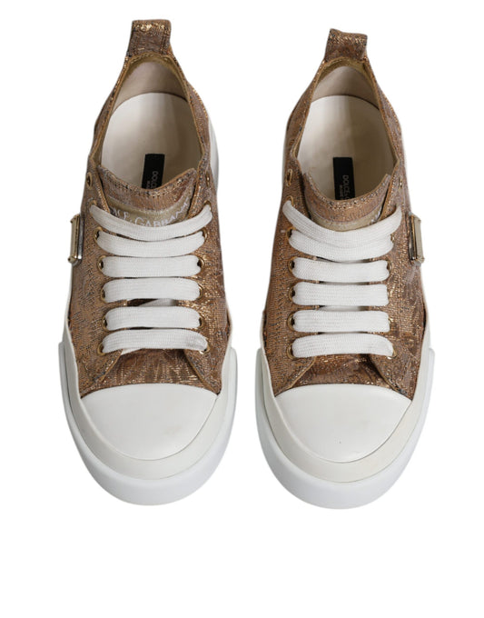 Pair of gold and white sneakers with logo detailing