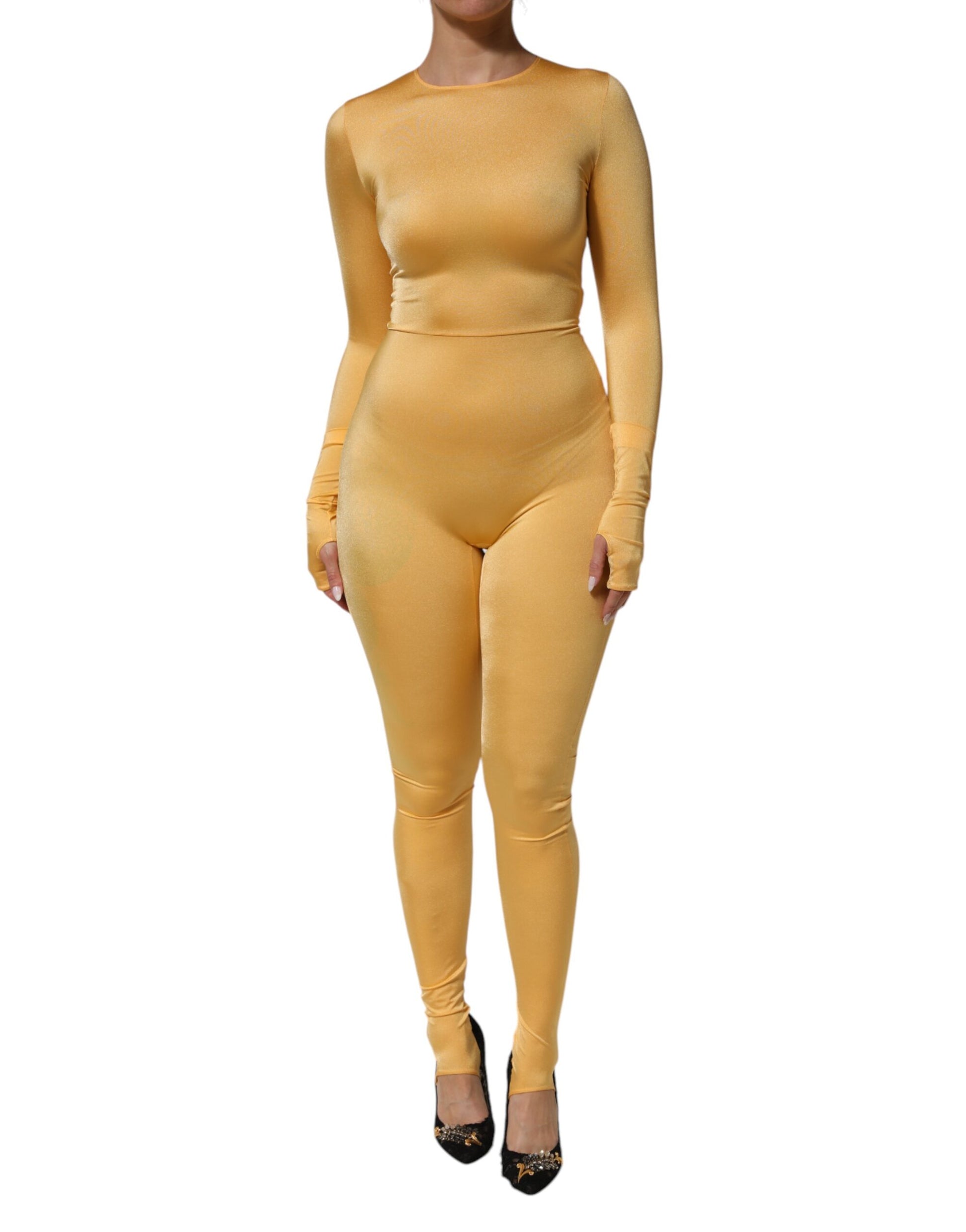 A woman wearing a gold yellow stretch long sleeve bodysuit dress