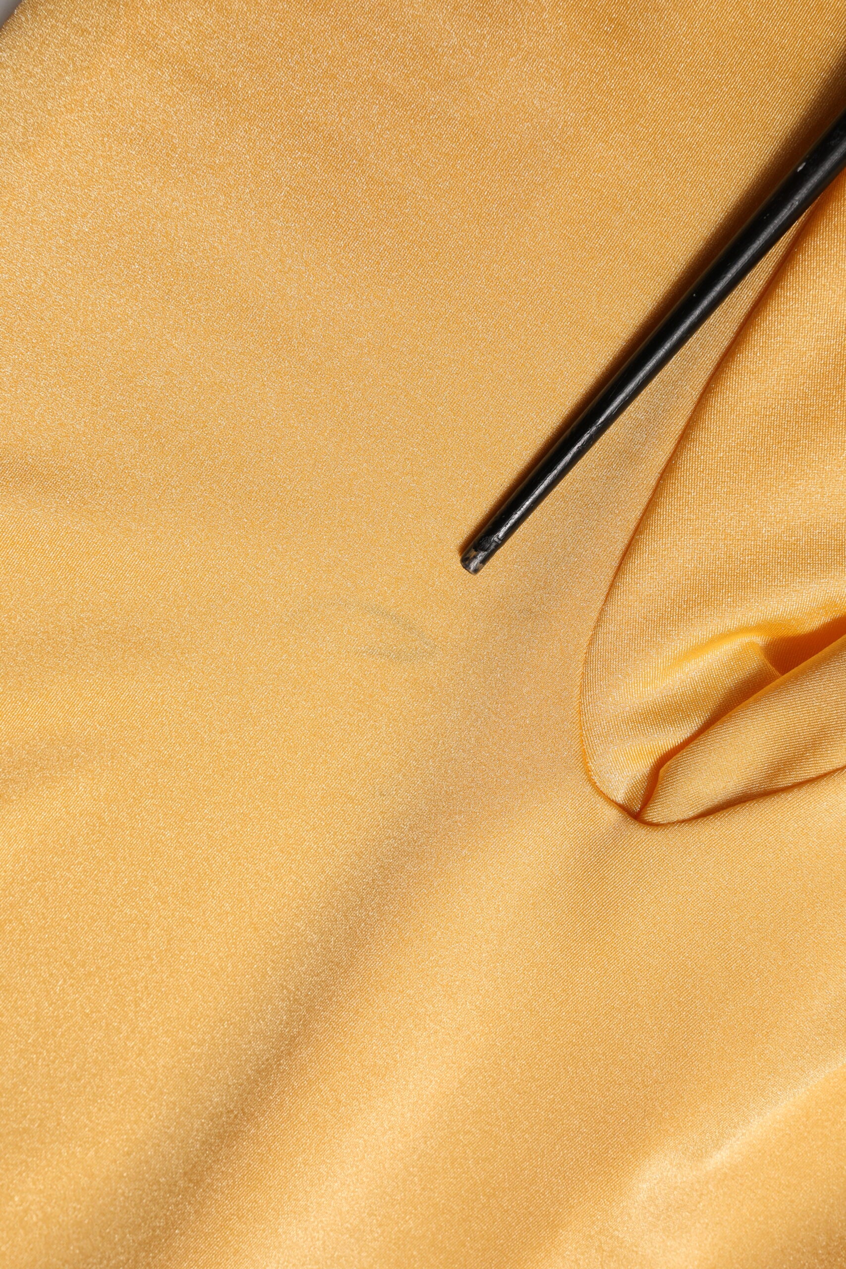 A gold yellow stretch long sleeve bodysuit dress with black zipper
