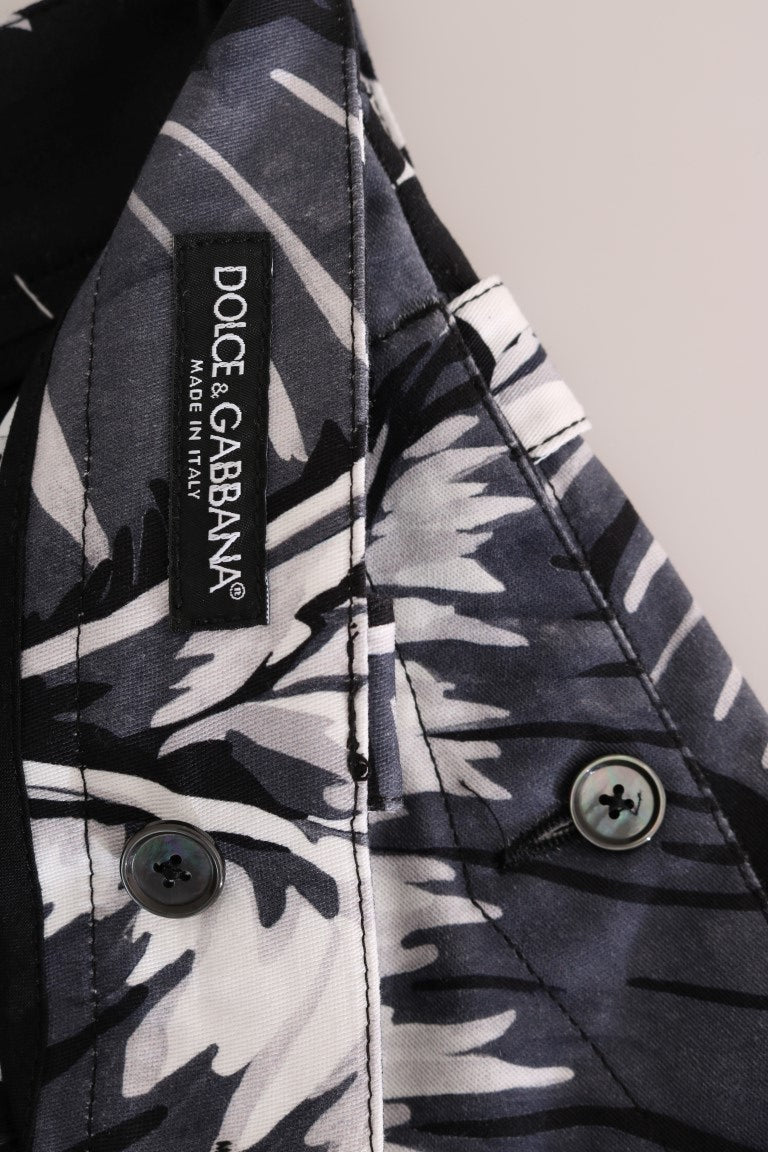 The shirt is black and white with a floral pattern