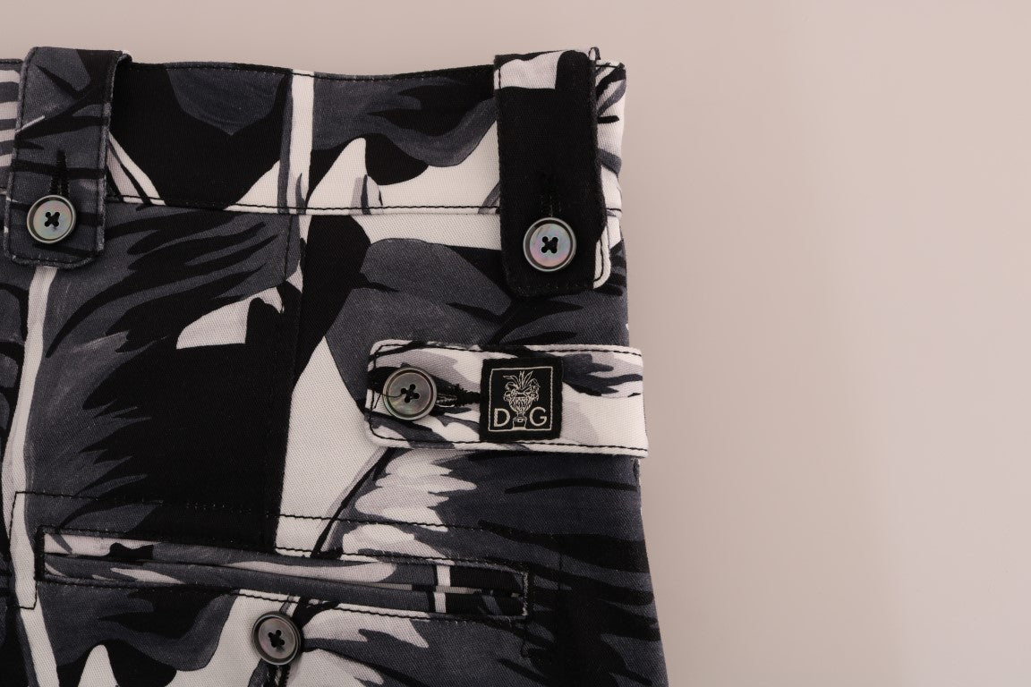 Pair of camouflage patterned shorts with pockets and buttons