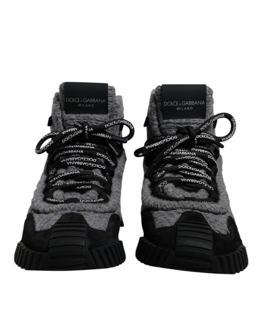 Pair of black and grey sneakers with white laces