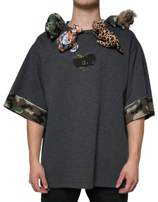Mannequin wearing a grey hoodie with camouflage sleeves and a heart design on front
