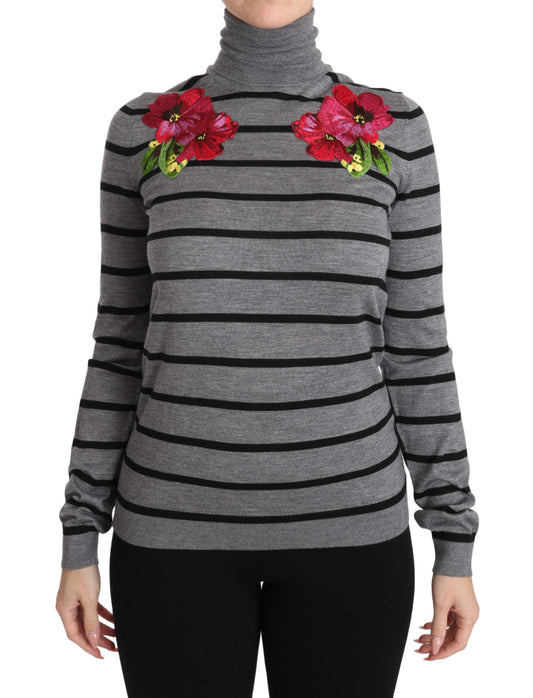 Woman's long sleeve sweater with horizontal stripes and floral embellishments on chest