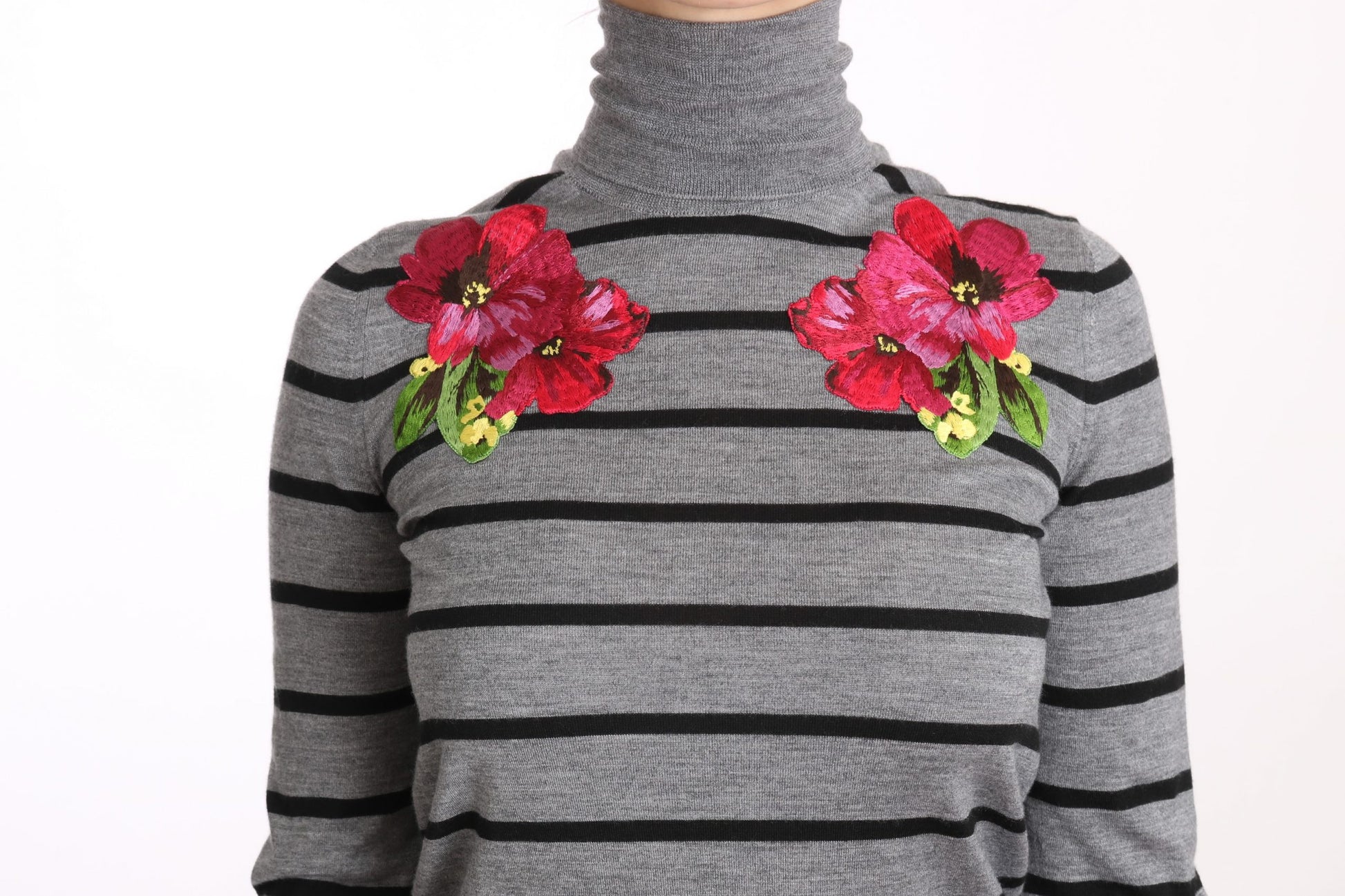 Grey sweater with black stripes and red flowers on shoulders