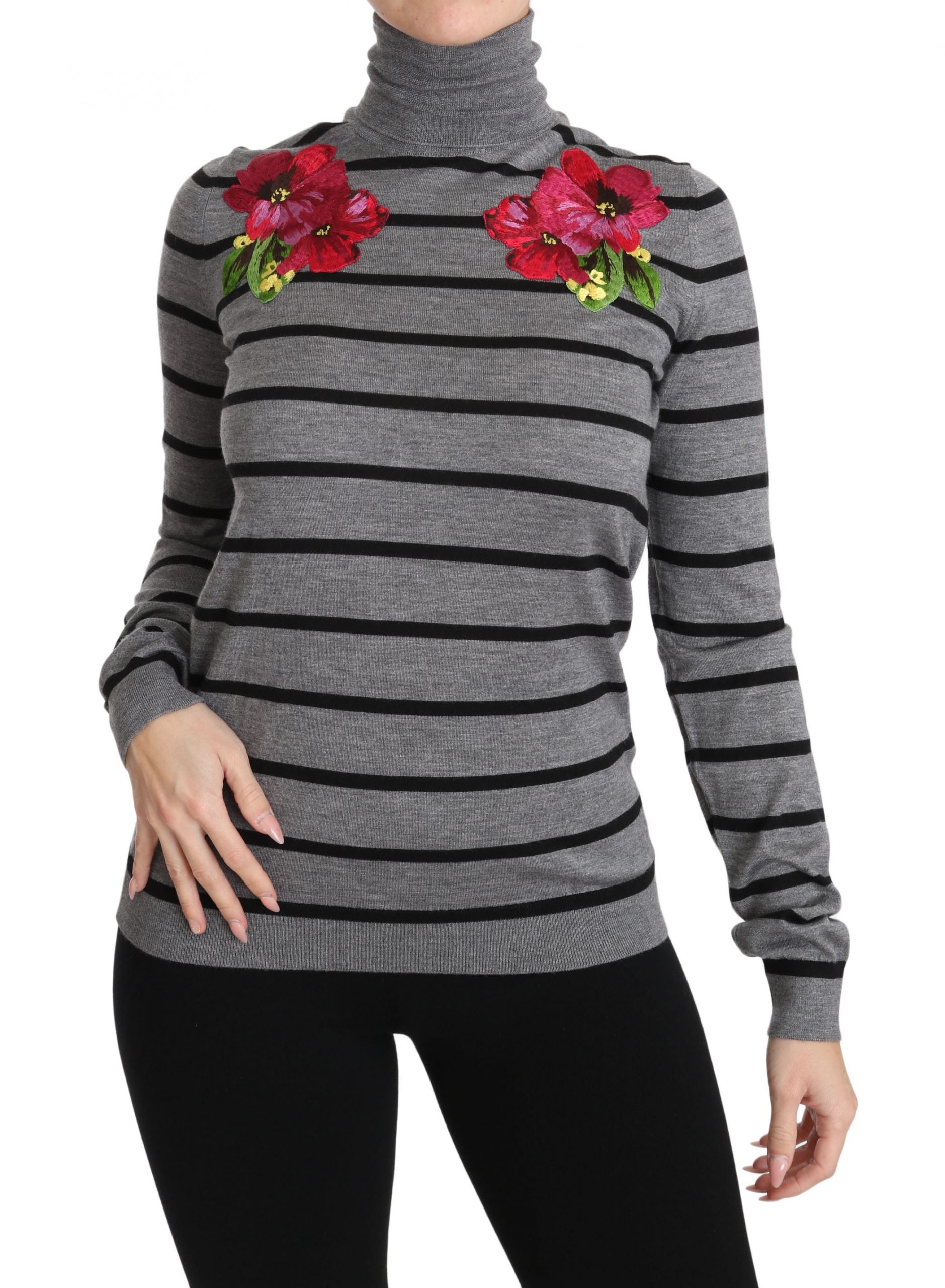 Black and white striped sweater with red flower embellishments on shoulders