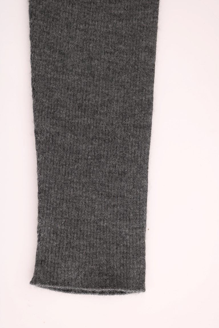 Black knitted sleeve on white surface